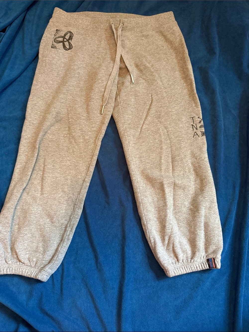 TNA size XS 3/4Gray Sweatpants with Drawstring. Many logos